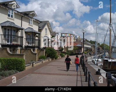 dh  HOTWELLS BRISTOL New houses two people walking along harbour waterfront england house modern home uk residential building street luxury exterior