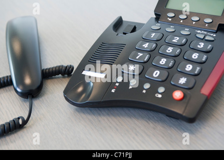 Receiver off landline phone Stock Photo