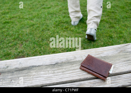 left wallet on a bench in the park Stock Photo - Alamy