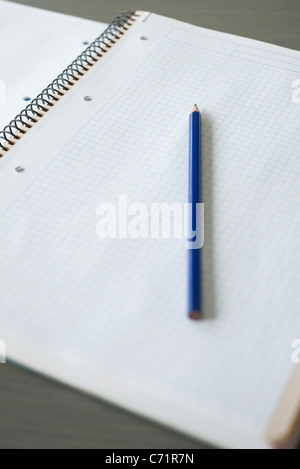 Spiral notebook and pencil Stock Photo