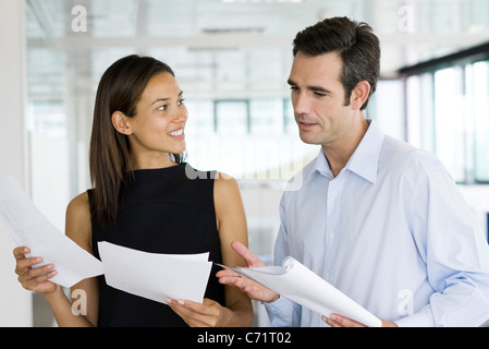 Colleagues discussing documents Stock Photo