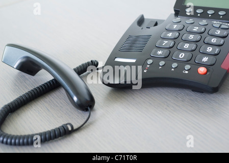 Receiver off landline phone Stock Photo