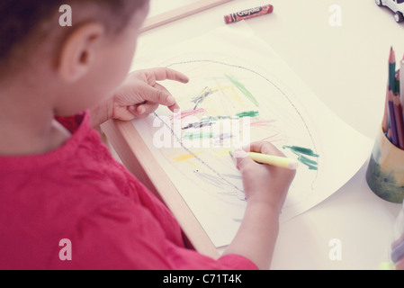 Little girl drawing, high angle view Stock Photo