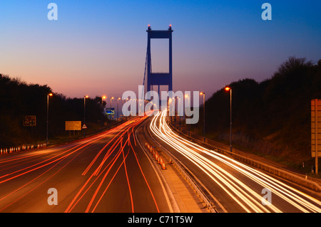 Traffic trails on the approach to the Severn Bridge at Aust, Gloucestershire, England Stock Photo