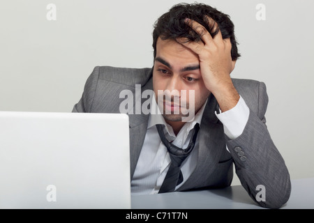 Businessman stressed at work Stock Photo