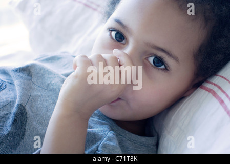 Little girl sucking thumb Stock Photo