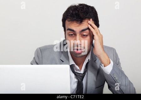 Businessman stressed at work Stock Photo