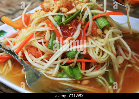 plate of Thai papaya salad also known as som tam Stock Photo