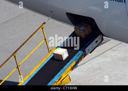 packets loading on a plane Stock Photo