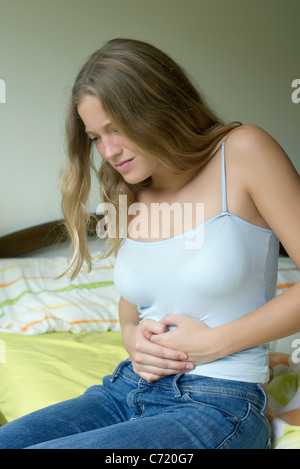 Woman experiencing period pains Stock Photo - Alamy