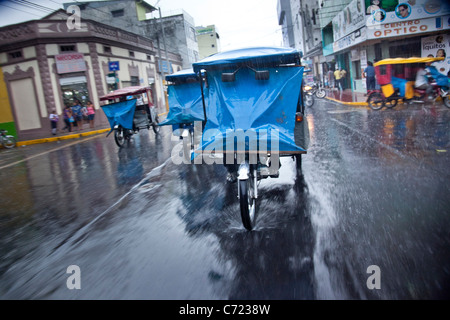 Motor taxi traffic in downtown Iquitos, Peru Stock Photo