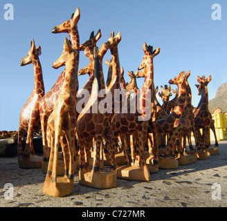 Group of hand carved wooden giraffes on sale at a market in Hout Bay, South Africa. Stock Photo