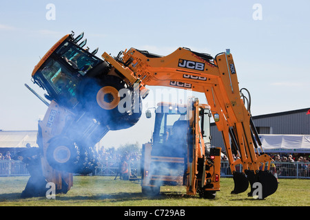 Dancing JCB Diggers display at the Anglesey County Show in the Mona showground. Isle of Anglesey, North Wales, UK, Britain Stock Photo
