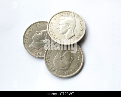 Three half crown coins from the 1940's each 2/6 pence 30 old pence or 12.5 new pence Stock Photo