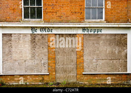 Boarded up village shop Stock Photo