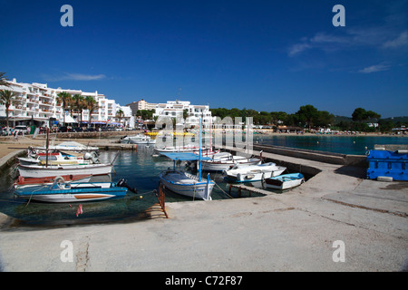 Fishing boats moored at the beach of Es Canar, Ibiza, Spain Stock Photo