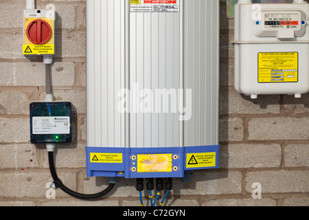 A household solar panel power system, showing the converter that converts the solar panel output from DC to AC. Stock Photo