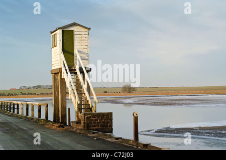 Refuge cabin on the tidal causeway road leading to Lindisfarne. Stock Photo