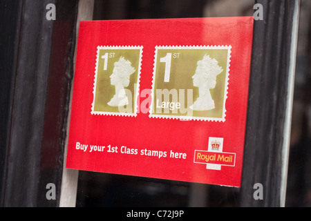Sign advertising 1st class stamps for sale in the UK Stock Photo