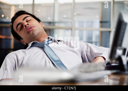 Businessman sleeping in the office Stock Photo