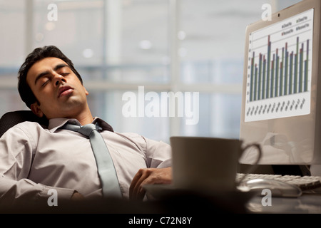 Businessman sleeping in the office Stock Photo