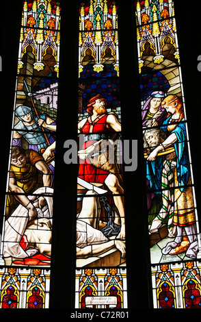 Stained glass window depicting beheading of St John the Baptist by Herod Antipas. Stock Photo
