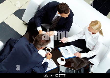 Photo of successful partners discussing business ideas at meeting Stock Photo