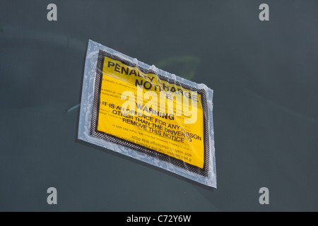 Penalty Charge Notice fixed to windscreen of car Stock Photo