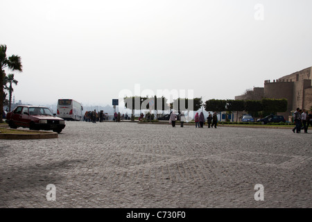Large open space outside the Saladin Citadel, near the parking, in Cairo, Egypt. A large parking space with some tourists Stock Photo