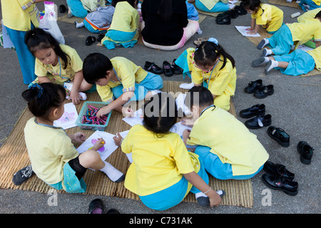 Young School Children in Buak Haad Park, Chiang Mai, Thailand Stock Photo