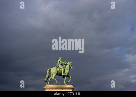 Bronze equestrian statue of Henry IV, where the Pont Neuf meets the Ile de la Cite, Paris, France Stock Photo