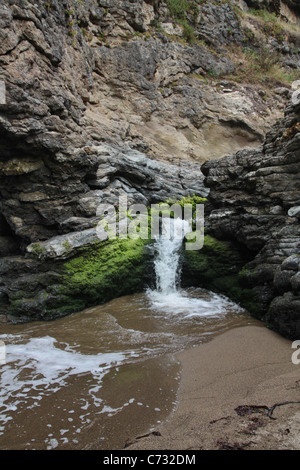 A small waterfall at Arch Rock in Point Reyes, California Stock Photo