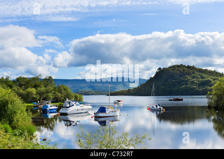 Boats moored on the loch at Aldochlay on the west bank of Loch Lomond, Argyll and Bute, Scotland, UK Stock Photo