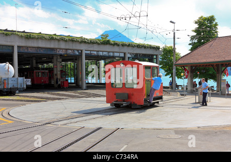 A small Locomotive of the Rigi Mountain Railway on a Turntable at the Vitznau Railway Station, Lake Lucerne, Switzerland Stock Photo