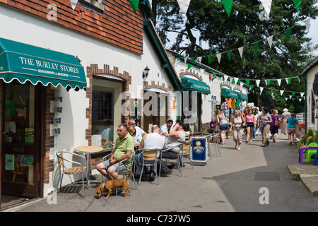 Pavement cafe and shops in the village of Burley in the New Forest, Hampshire, England, UK Stock Photo