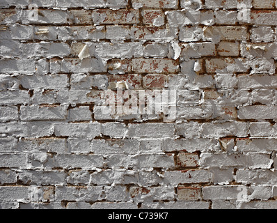 Peeling paint on brick wall. Stock Photo