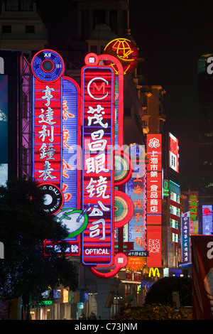 Neon signs above shops along Nanjing Road, Shanghai, China Stock Photo