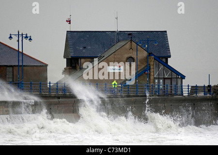 Huge waves crashing into the breakwater at the entrance to Porthcawl harbour early this morning. Stock Photo