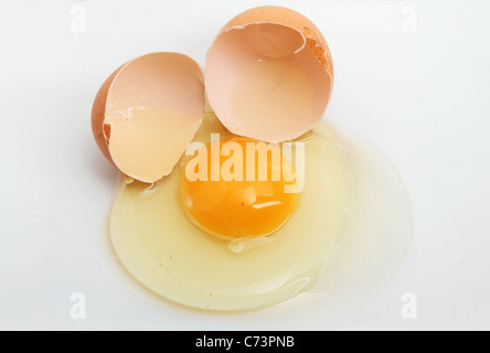 Cracked egg and shell on a white background Stock Photo