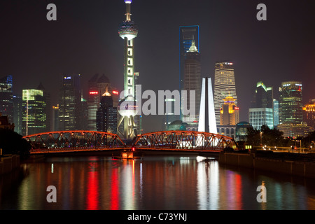 New Pudong skyline Waibaidu (Garden) Bridge looking across the Huangpu River from the Bund Shanghai China Stock Photo