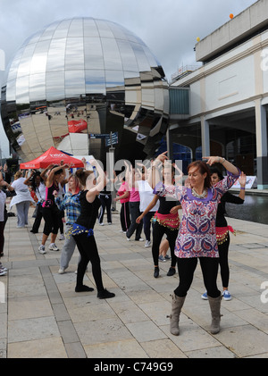 Zumba dance class in Bristol city harbour and pedestrian square for entertainment UK Stock Photo