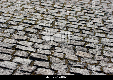 Old stone pavement closeup, small stones Stock Photo
