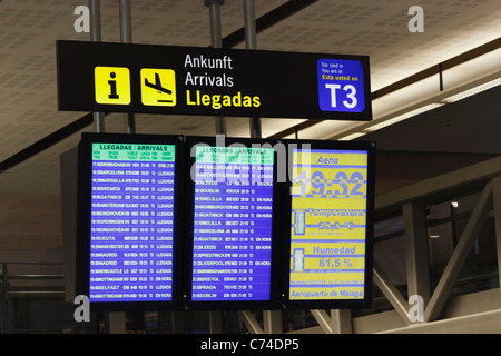 Flight departure boards at Malaga airport, Malaga Province, Costa del Sol, Spain. Stock Photo