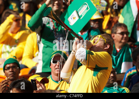A South Africa fan blows a Vuvuzela at the opening match of the FIFA World Cup between South Africa and Mexico June 11, 2010. Stock Photo