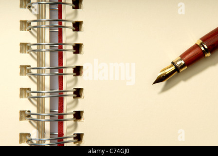 Add your own element. An open spiral notebook with blank pages. Stock Photo