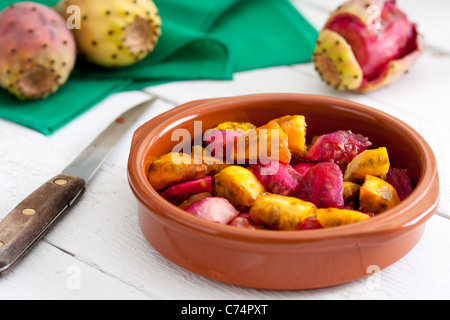 Sliced Indian Figs in a Bowl on White Wood