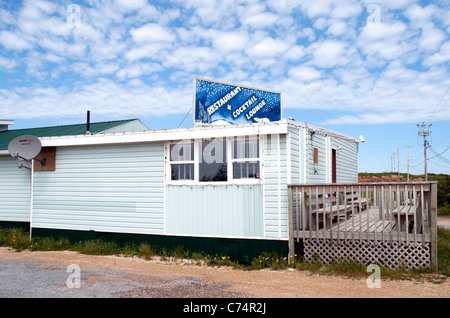 The exterior of a restaurant and bar in a wooden bungalow in the subarctic northern town of Churchill, Manitoba, Canada. Stock Photo