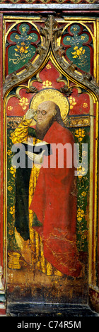 Cawston, Norfolk, rood screen. St. Matthew wearing spectacles, with money box at his feet, English medieval screens painting Stock Photo
