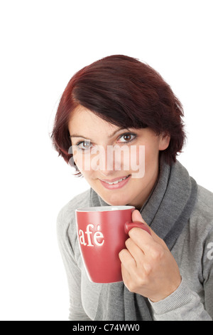 Young woman drinks from coffee mug Stock Photo