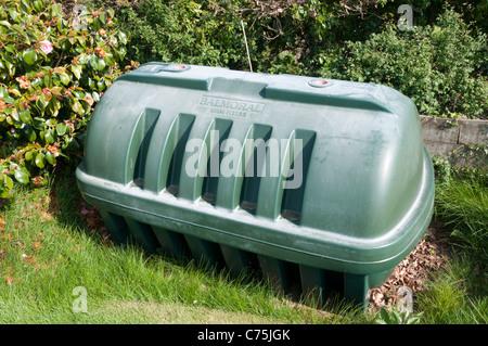 A central heating oil tank in a domestic garden. Stock Photo